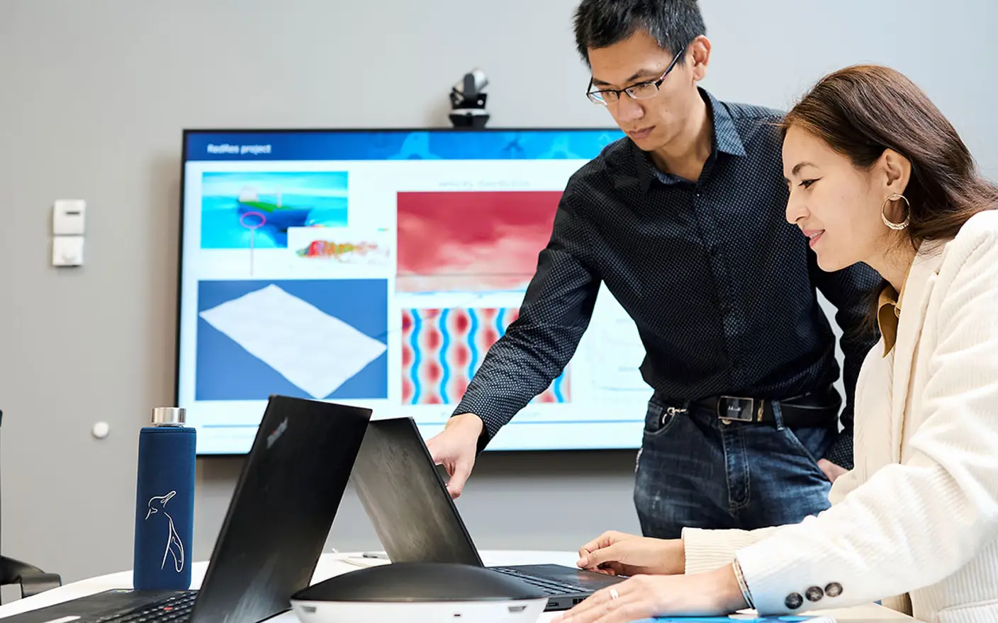 Coworkers helping each other.